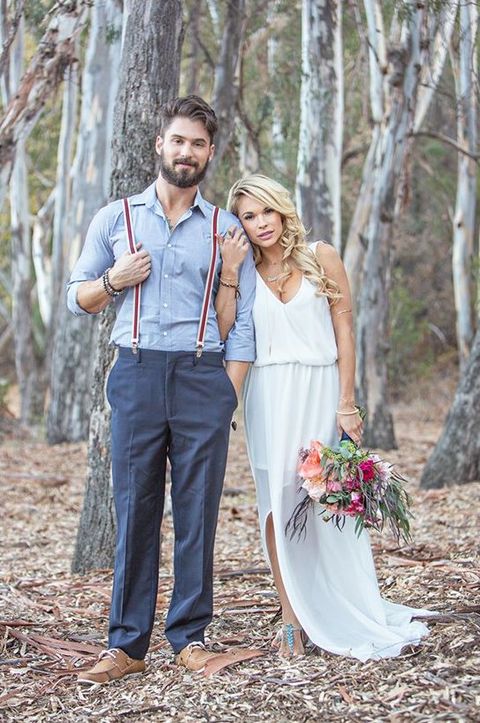 a rustic groom's look with a blue shirt, grey pants, striped suspenders, brown shoes for a simple and casual look