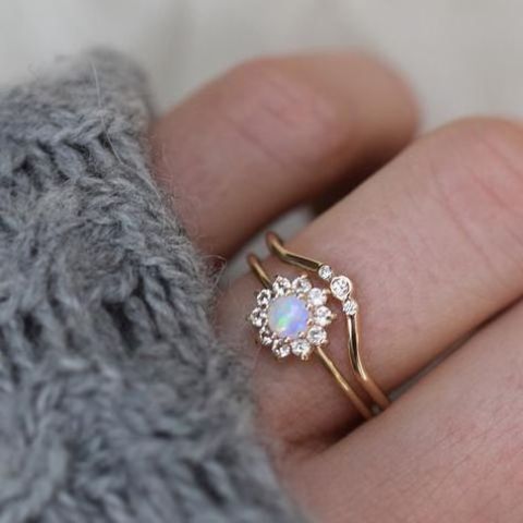 a stylish engagement ring with a pearl and diamonds looks very sophisticated and very beautiful adding a feminine touch to the look