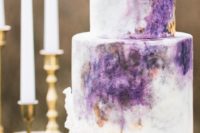a watercolor violet wedding cake is a bold and trendy idea
