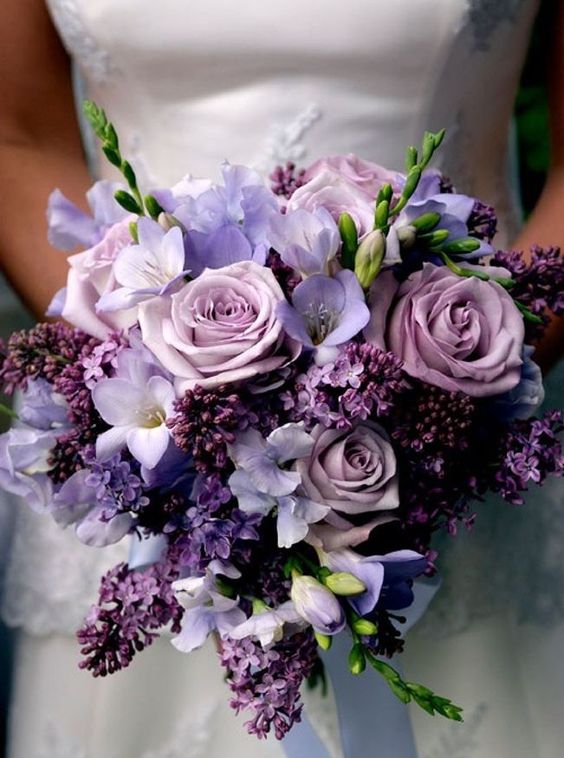 a wedding bouquet in ths shades of purple and lilac looks very soft and romantic