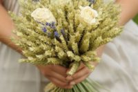 a wheat wedding bouquet with three creamy roses and some lavender is a very rustic idea