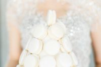 a white macaron tower is a glam and chic substitute to a usual wedding cake