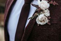 an elegant fall groom’s look with a burgundy tweed pantsuit, a white shirt and a textural burgundy tie is a great idea to rock