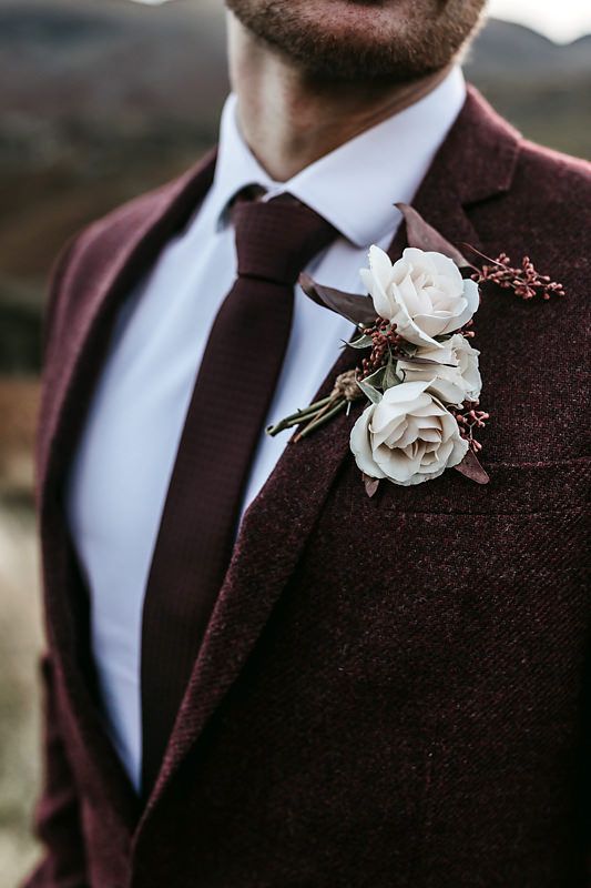 an elegant fall groom's look with a burgundy tweed pantsuit, a white shirt and a textural burgundy tie is a great idea to rock