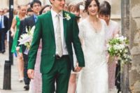 an emerald wedding suit with a grey tie, white shirt and brown shoes for a retro-inspired groom’s look
