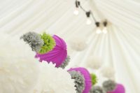bright purple paper lamps, white, grey and green paper pompoms make the tent look fun and chic