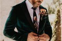 brown pants, a white shirt, a moody floral tie, an emerald velvet blazer and a large floral boutonniere are amazing for fall