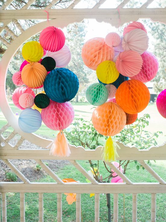 colorful honeycomb paper pompoms with tassels are amazing for wedding decor anywhere