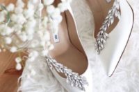 white wedding shoes with rhinestone detailing are amazing for a glam winter bride