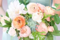 a chic bridesmaid bouquet with creamy, blush and coral blooms and greenery and succulents