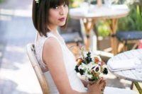 a classy straight bob with bangs and a pretty red and white floral headpiece is a very bold and modern idea