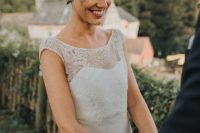 a long and wavy pixie haircut with a greenery and white floral crown is a lovely idea for a boho bride
