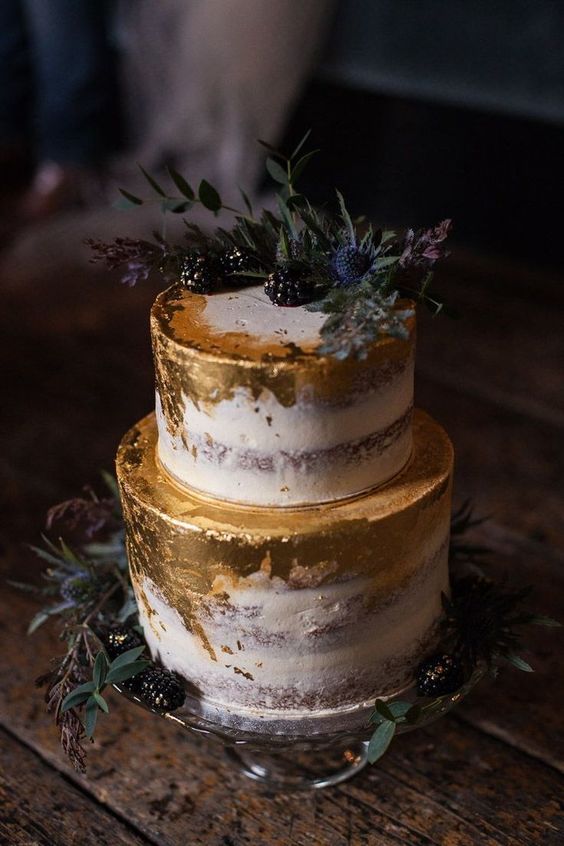 a naked wedding cake with gold leaf, thistles and blackberries is an ultimate option for a fall wedding