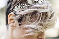 a pixie haircut with waves and a floral rhinestone headband looks wow and very feminine