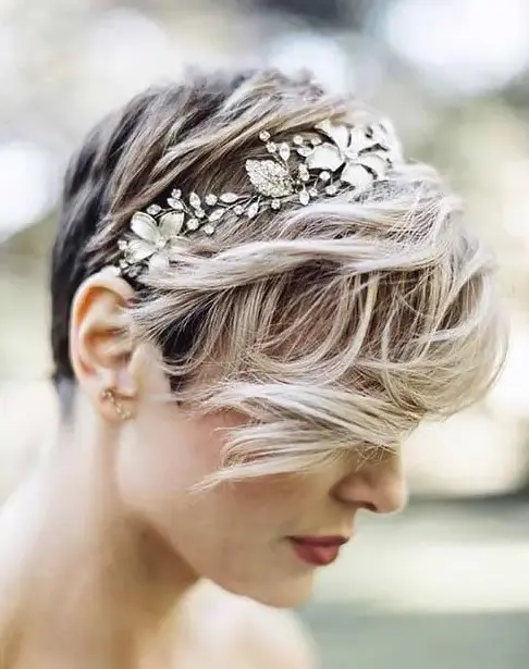 a pixie haircut with waves and a floral rhinestone headband looks wow and very feminine
