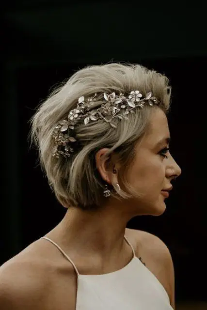 a short bob with much texture and a luxurious rhinestone flower headpiece is a gorgeous idea