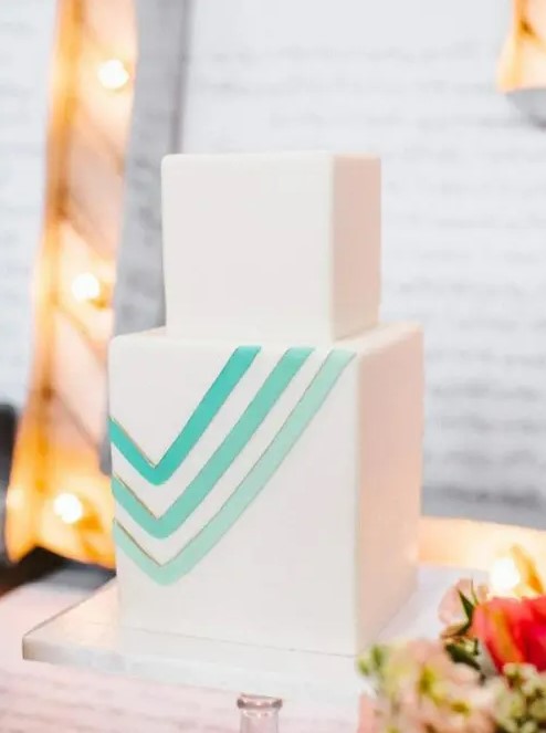 a super elegant and modern square wedding cake decorated with green to aqua chevrons is a lovely and fresh idea for a spring or summer wedding