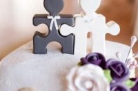 lovely black and white puzzle cake toppers showing a bride and a groom is a gorgeous idea to show that you are a perfect match