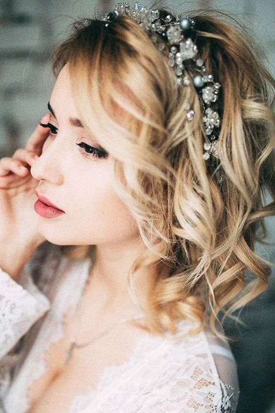 short and wavy blonde hair with a crystal and bead tiara is amazing for a modern glam bride