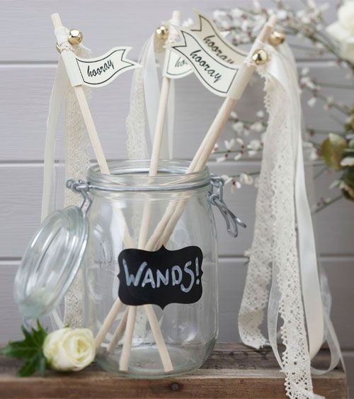 wedding wands with lace ribbons, mini bells and letters are a fun and cool idea for a wedding exit