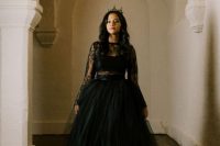a bold bridal look with a black crop top, a sheer lace top over it and a black tulle skirt plus a bold tiara is amazing