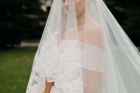 a lovely bride’s outfit with a veil