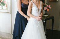 a chic navy A-line maxi dress with a sequin bodice, thick straps and a layered skirt for a feminine and very cute look
