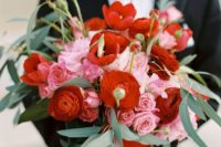 a colorful wedding bouquet in red and pink plus foliage is a creative and bold idea to rock