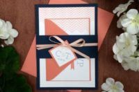 a coral and navy wedding invitation suite with prints and bows for a bold and whimsy wedding