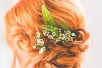 a ginger red tight low updo with a bit of volume on top, some locks down and some blooms and fern is a lovely idea for a boho bride