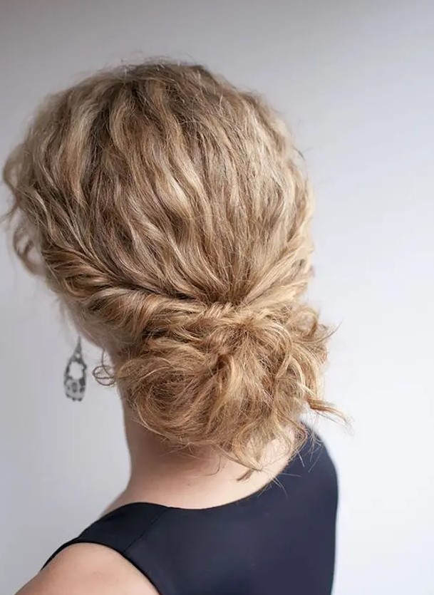a low bun with straightened hair and locks down is an exquisite option to rock at a wedding