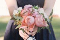 a navy sleeveless bridesmaid dress and a coral and ivory bouquet to make a contrasting combo