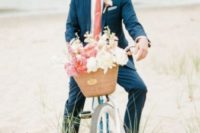 a navy suit, a white shirt and coral tie for an ultimate beach groom’s look