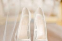 a pair of airy and chic white lace wedding shoes is a gorgeous idea for a wedding, it will add a lovely touch to the bridal look