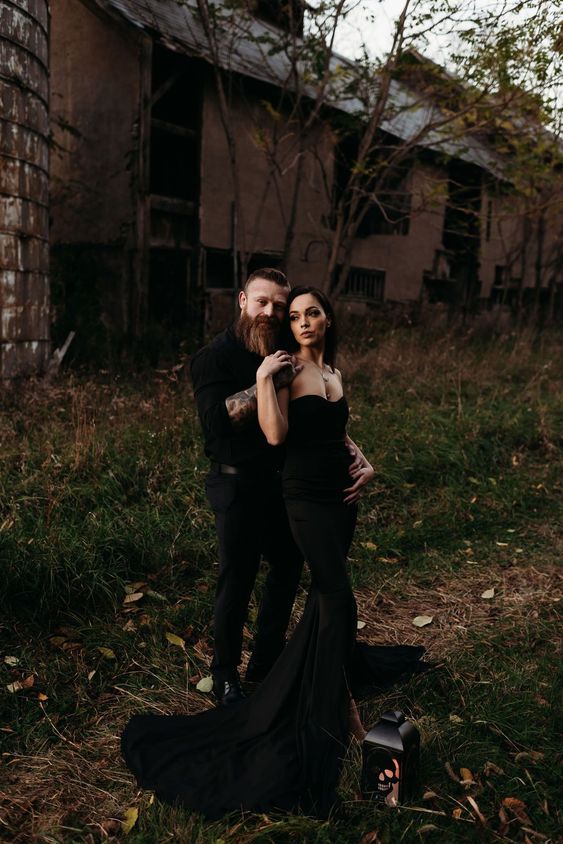 a sleek strapless black mermaid wedding dress with a large tail for a very sexy and bold Halloween bridal look