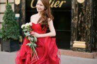 a strapless red wedding dress with a layered full skirt is a gorgeous idea for a color-loving bride