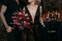 a stunning black lace A-line wedding dress with a plunging neckline and thick straps plus pockets is a gorgeous idea for Halloween