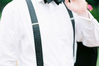 a stylish look with a tuxedo, printed suspenders and a black bow tie is timeless elegance