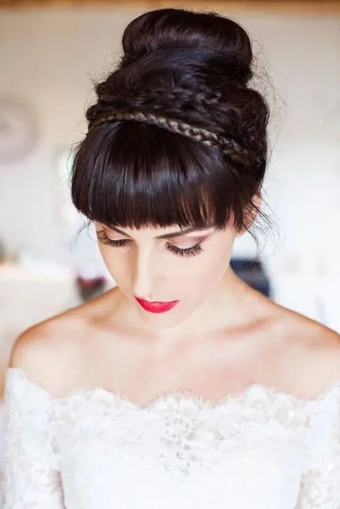 a tight top knot with a bit of braids and a fringe looks chic and bold and will keep you picture-perfect all day long