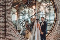 a unique wedding backdrop – an oversized mirror clock is a cool idea for a modern or industrial wedding