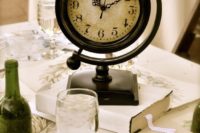 a vintage wedding centerpiece with a stack of books and a large vintage clock is a creative ide