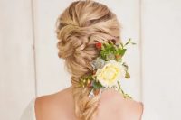 a voluminous curly twisted braid is great for relaxed and boho chic bridal styles