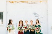 all mismatched bridesmaids’ dresses in teal,emerald, red and black with different designs