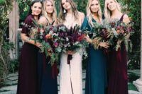 all mismatched bridesmaids’ looks in plum and teal dresses to show off the personal style of each girl