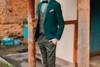 an emerald blazer, a green plaid shirt and a woolen suit with a waistcoat plus tan Chelsea boots