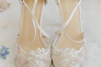 beautiful and delicate lace wedding shoes with butterfly appliques are amazing for a refined vintage wedding