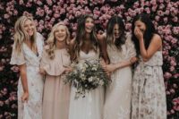 bridesmaids in mismatched floral maxi dresses and in blush ones for a beautiful spring or summer wedding