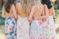 bright floral print mismatched maxi dresses with open backs and spaghetti straps for a bright summer wedding