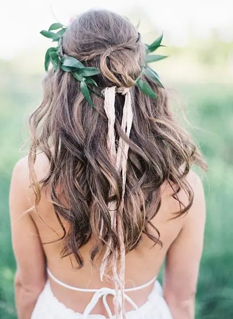 loose waves with a braid and a leaf crown look boho and relaxed and will fit a cool summer bridal look