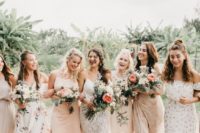 mismatched blush and neutral printed bridesmaid dresses of midi and maxi lengths for a summer wedding